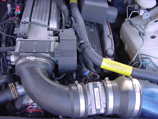 3 inch ruber plumbing elbow connecting to the oval throttle body